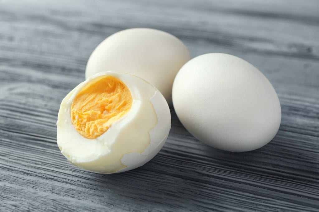 hard boiled eggs against a grey wooden background