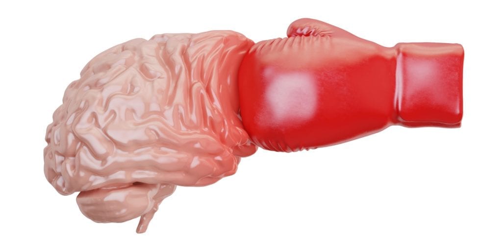 boxing glove punching a fake brain