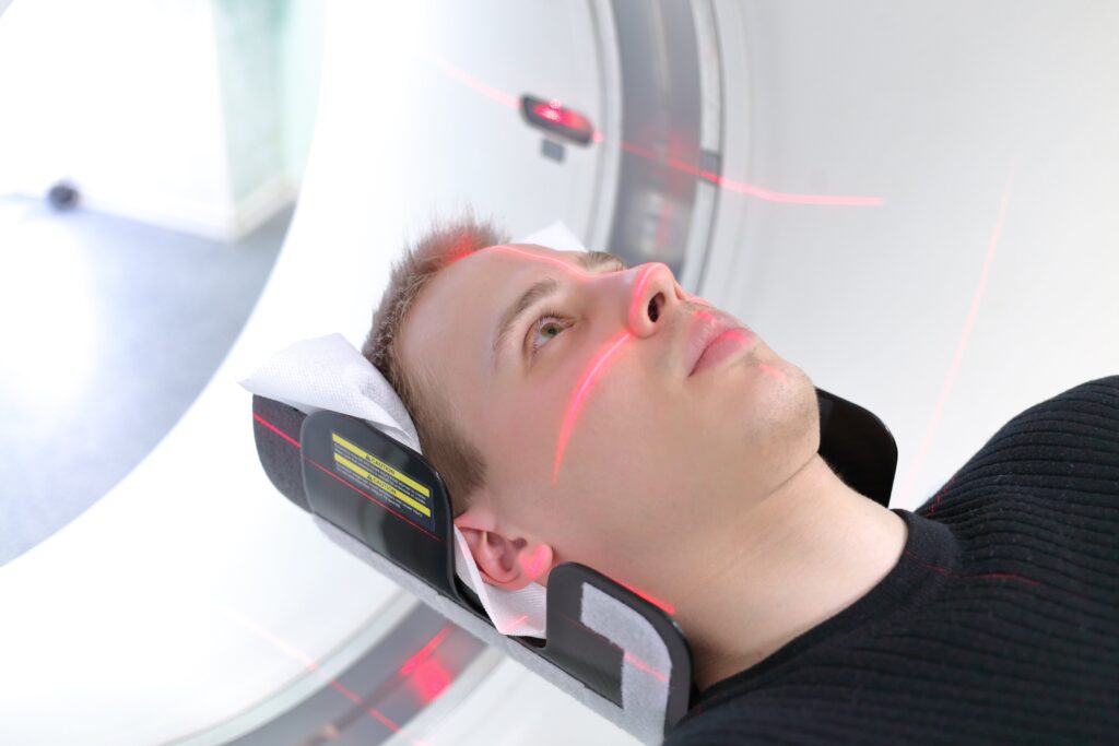 man having a CT scan of his head
