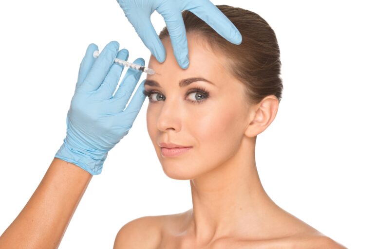 woman having botox injected into her forehead