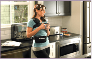 person in kitchen with brain monitoring device on
