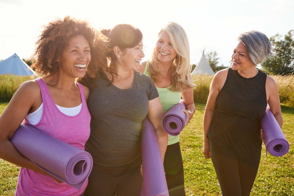 group of women walking to yoga together