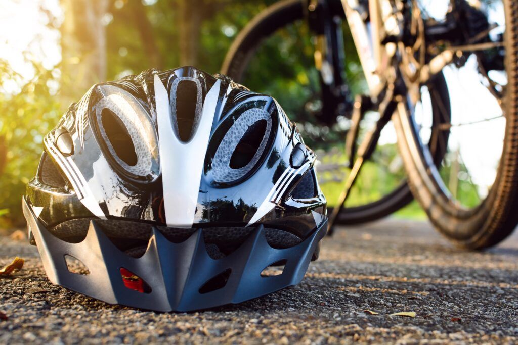bike helmet on ground beside bike
