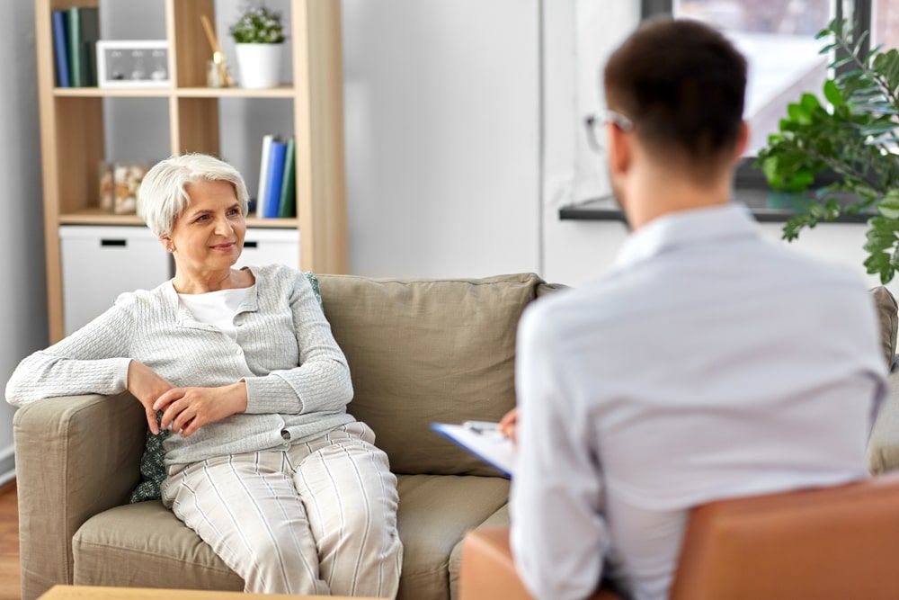 older woman speaking to a therapist