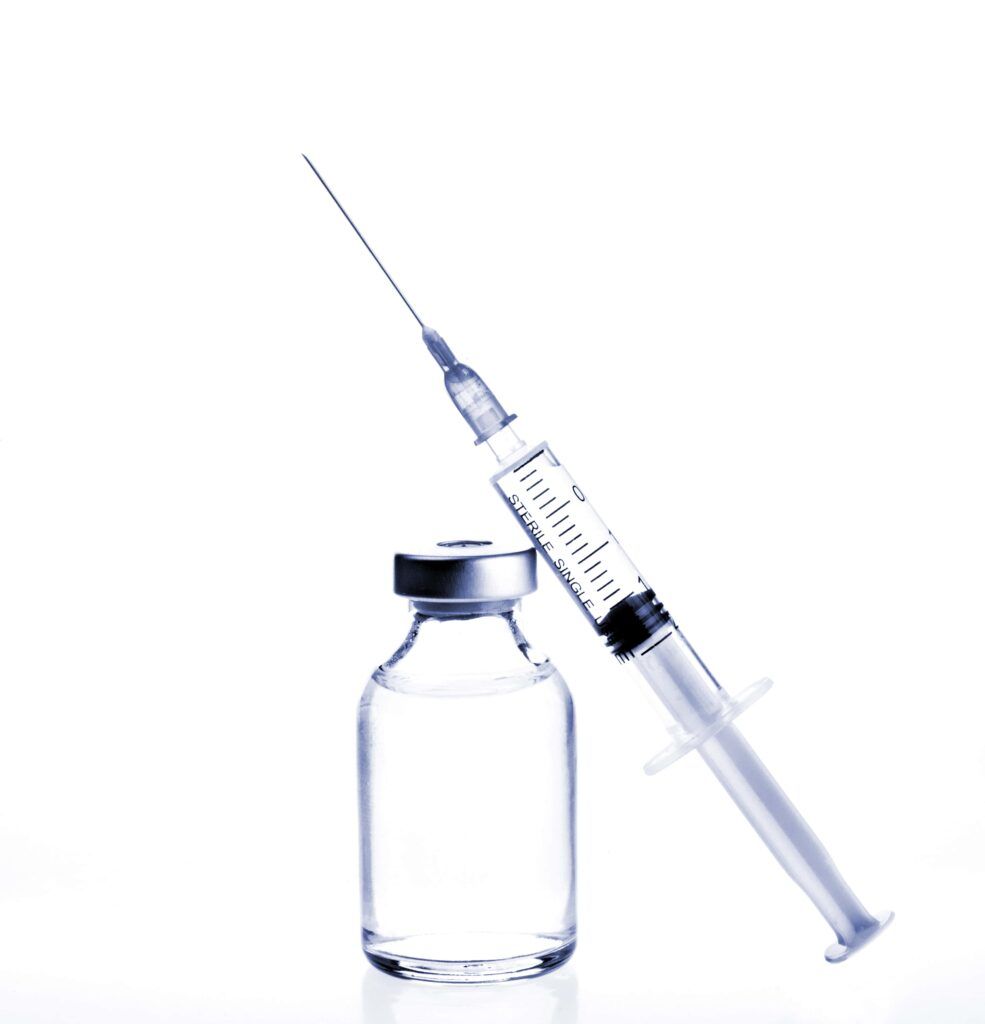 Glass Medicine Vial and botox hualuronic collagen or flu syringe. Tinted image.