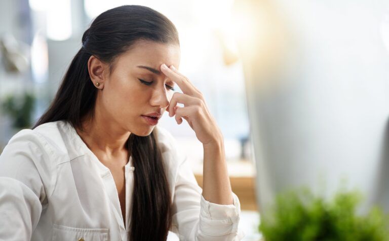 Stress, burnout or businesswoman with headache in office with fatigue, anxiety or depression. Depressed employee, sad female consultant or tired person frustrated with migraine pain in workplace